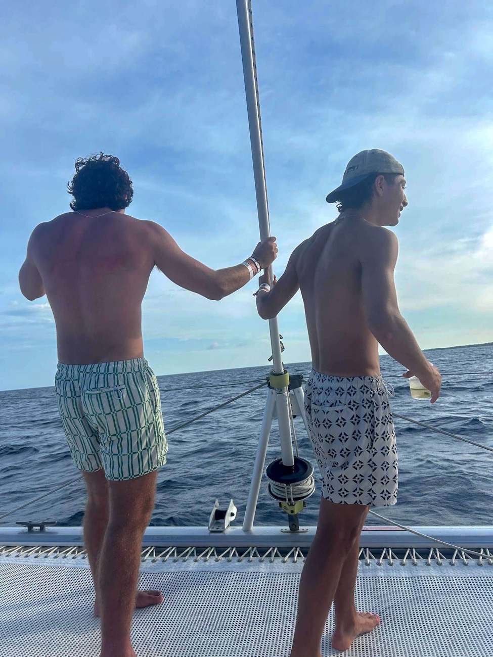 Two friends sailing under an open sky